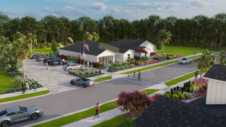 Jacksonville model park landscape with a showroom, flagpoles, and paver parking at Kings Creek