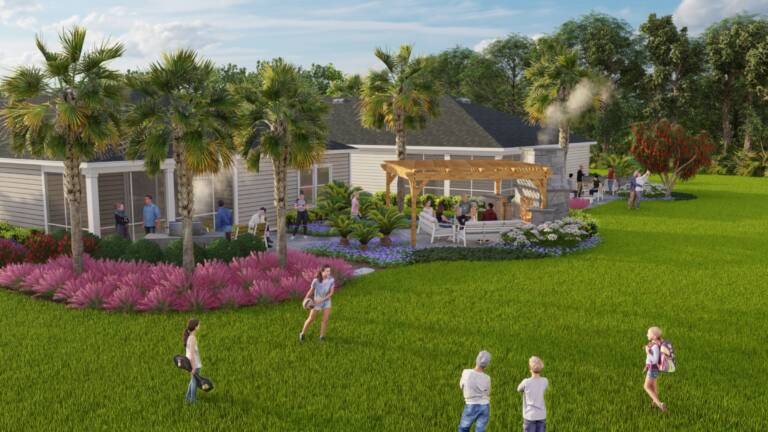 Model park landscape design in Jacksonville with a pergola, fireplace, and open lawn at Seaton Creek